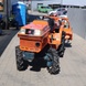 Мінітрактор Kubota B1 14 з фрезою, був у використанні, помаранчевий